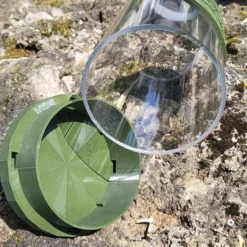 Mangeoire poule en plastique vert tube transparent Altéa 7kg - Evena